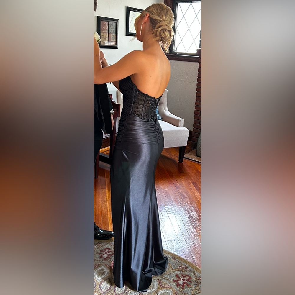 I am selling my sweetheart neckline strapless black prom dress with black beads